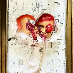 “Merge” - Computer circuit board, technical elements, clay, doll heads,70 × 55 × 30 cm, 2019